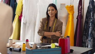 Image of a Fashion Entrepreneur proudly showcasing her work as a fashion designer